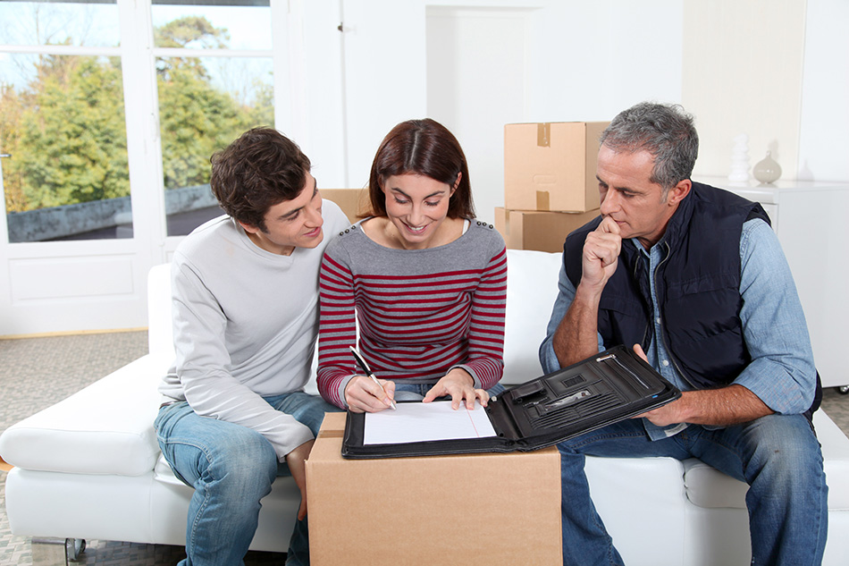 Three people booking secure furniture storage service in Oman | Quick Movers Oman